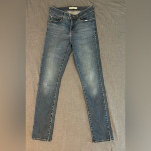 Mid rise skinny jeans in a blue wash, size 4, probably a 30-31” length.